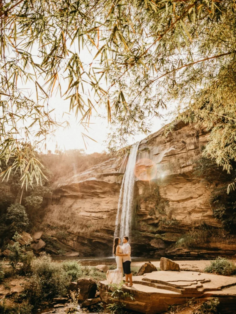 Newlyweds by waterfall